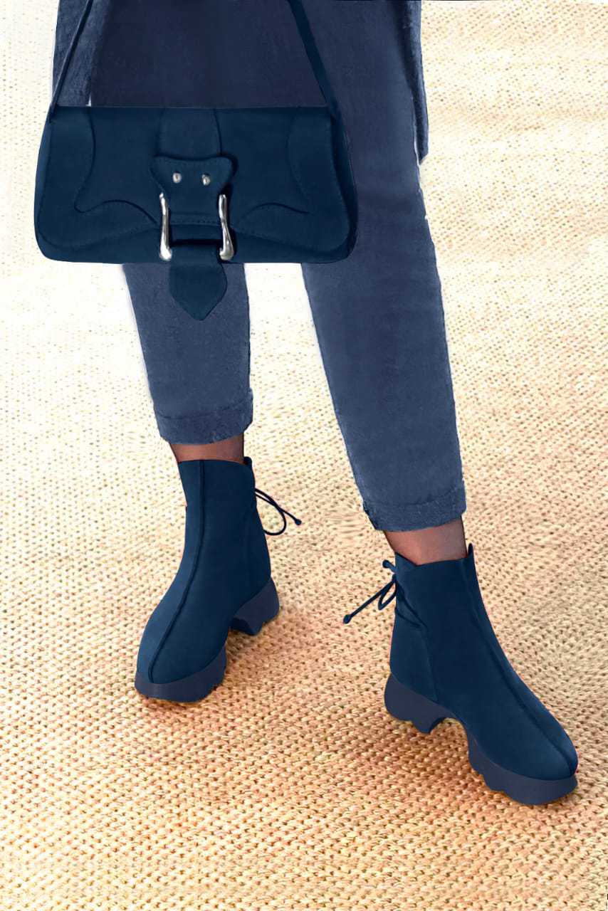 Navy blue women's ankle boots with laces at the back. Round toe. Low rubber soles. Worn view - Florence KOOIJMAN